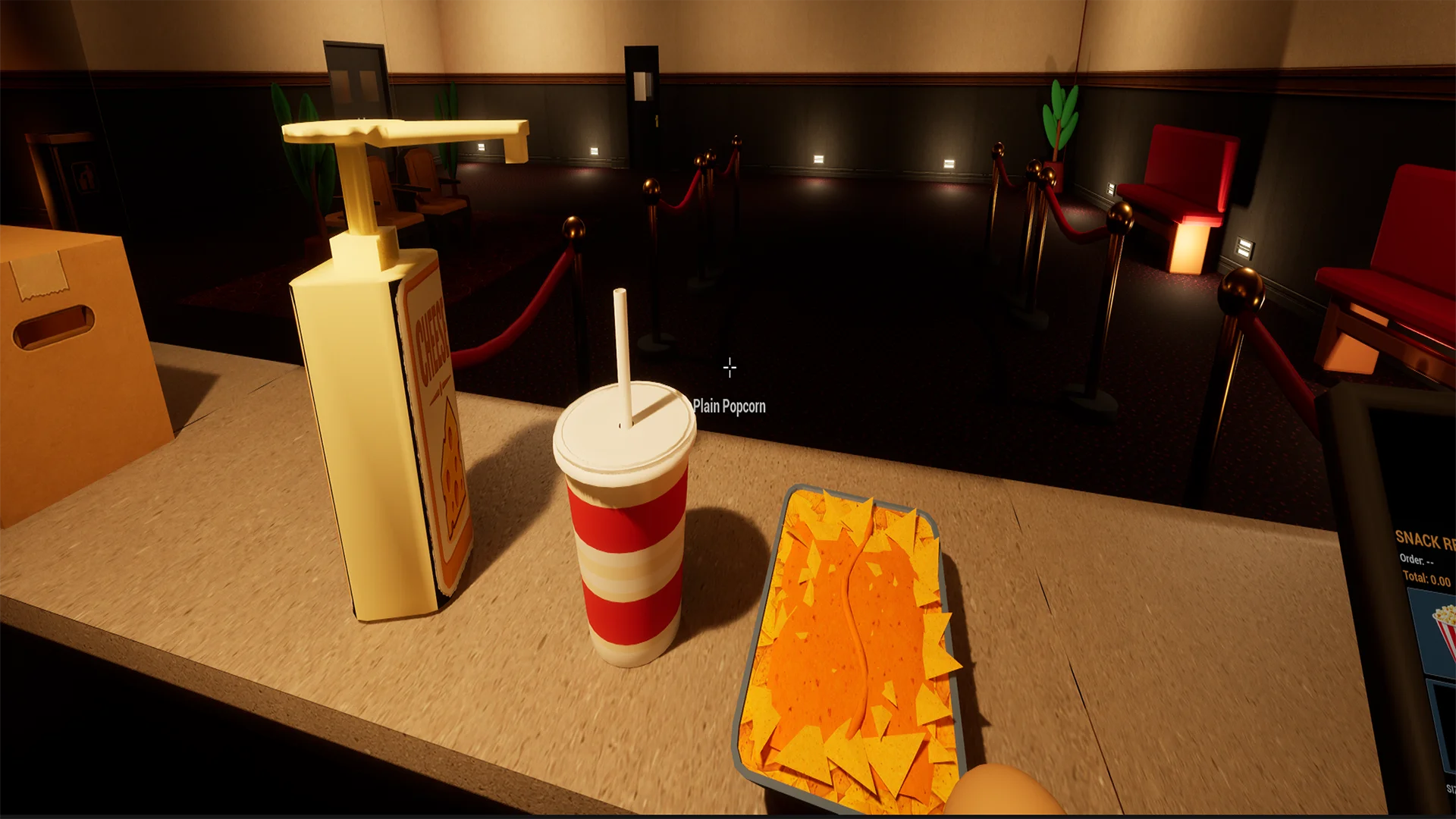 Getränk und Nachos an der Snacktheke in Chaos Cinema